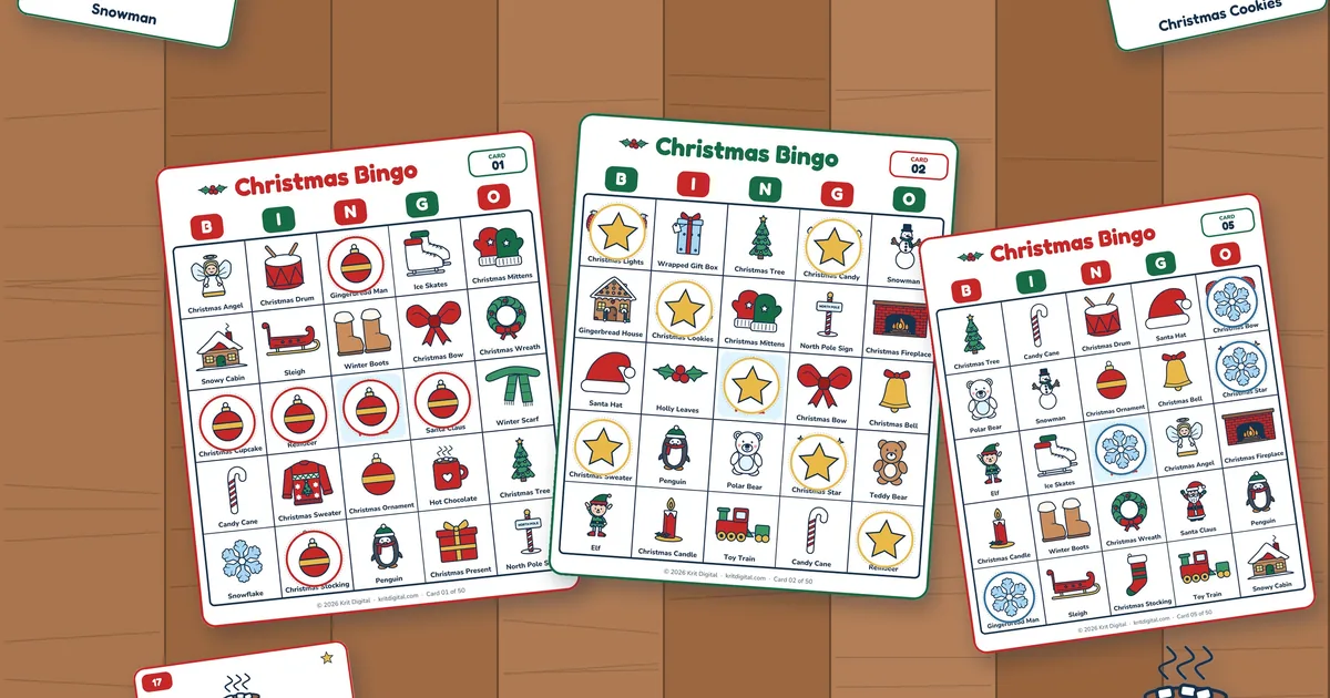 Three printed Christmas picture bingo cards on a wooden table, partly covered with ornament, star and snowflake markers